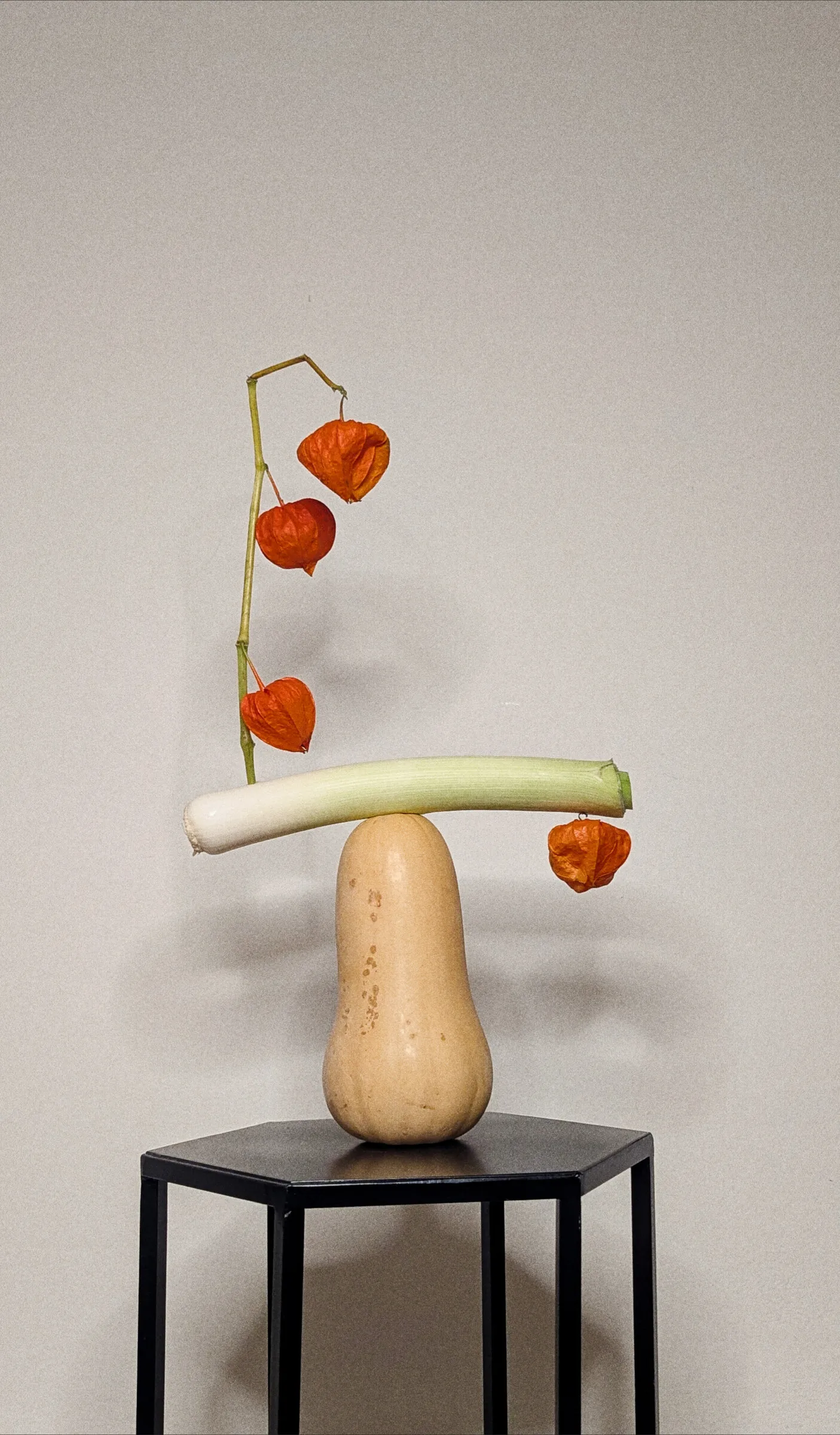 Ikebana with Pumpkin, Physalis & Leek floral arrangement